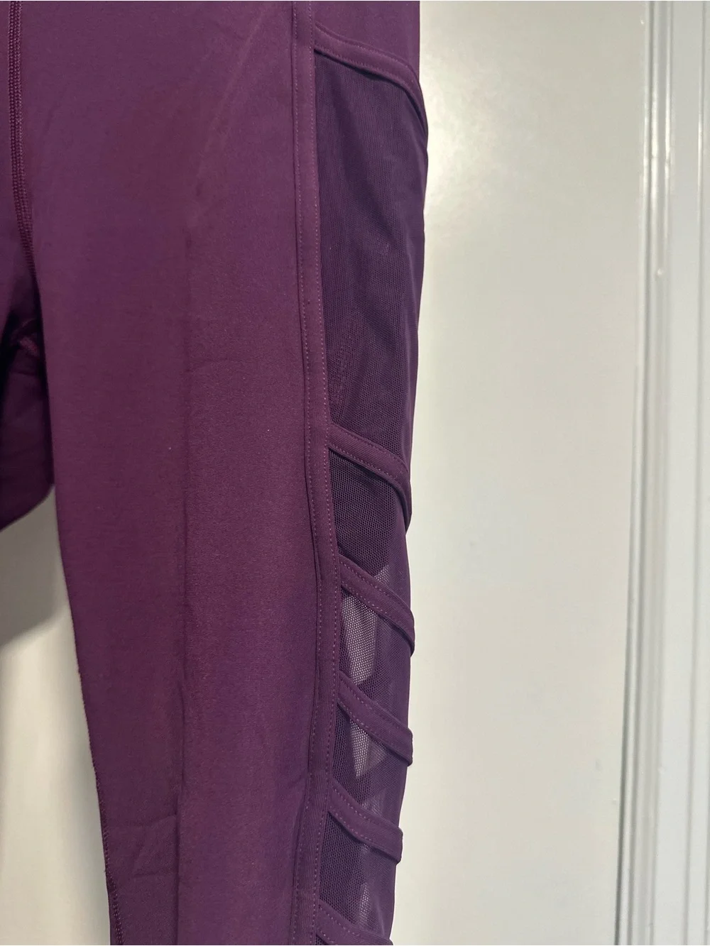Lululemon Wild and Free purple leggings mesh sides/ pockets strappy detailing.